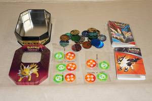 lot 61 image: Metal Tin of Pokemon Tokens and Accessories