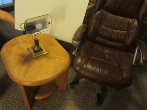 Office chair - shows wear on one ar...