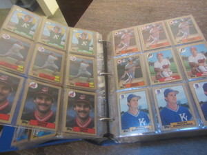 Baseball cards in a three inch 3-ri...