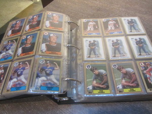 Baseball cards in a three inch 3-ri...