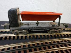 lot 92 image: Early Vintage Lionel O Operating Side Dump Car Part No.3659
