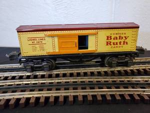 lot 104 image: Early Lionel O Tin Curtis Baby Ruth Box Car Part No. 2679