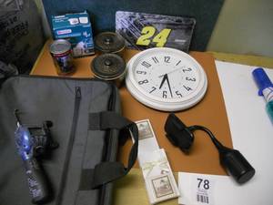 lot 78 image: Padded Laptop Case, Clock, Motion Sensor, Jeff Gorden License Plate, Fishing Game, Cell phone holder cup holder