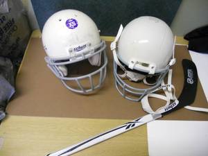 lot 120 image: Reebok Hocky Stick, 2 Hockey Helmets with Chin gaurds, pucks