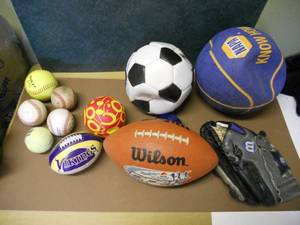lot 122 image: Wilson Football and Wilson Baseball Mitt, Baseballs, Softball, water balls, Soccer ball and basket ball