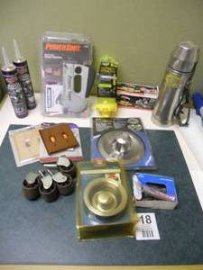 lot 18 image: Old Thermos, Powershot, Roof Cement, Misc Home Items, Casters, Nails