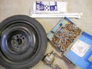 lot 148 image: Spare tire, Tire chains, Meat Grinder, Mop Head, Drawer Slides