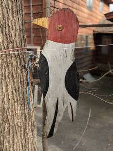 lot 601 image: Rustic Homemade Woodpecker Tree Decoration