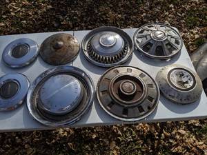 lot 209 image: (8) Vintage Hubcaps