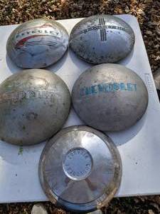 lot 202 image: (5) Vintage Chevy Dog Dish Hubcaps