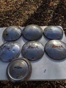 lot 204 image: (7) Vintage Dog Dish Hub Caps
