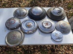lot 205 image: (9) Assorted Vintage Hub Caps