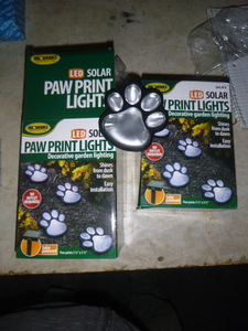 lot 27 image: 2 Sets of 4 LED Solar Paw Print Lights