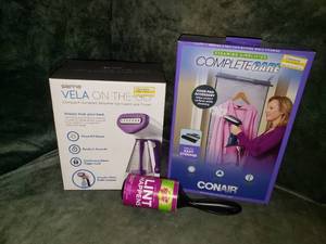 lot 104 image: Sienna VELA On-the-Go Garment Steamer & Door Pad Accessory
