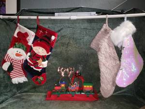 lot 22 image: 3 Cast Metal Train Stocking Hangers & 4 Stockings