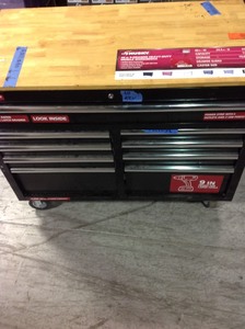 lot 101 image: 46 in. 9-Drawer Mobile Workbench in Black by Husky   whit damage please review the photos and missing key