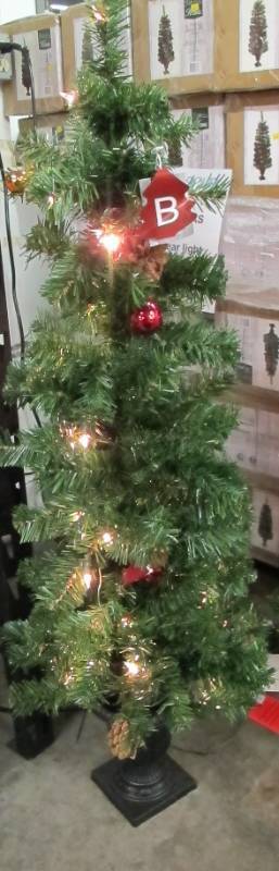 lot 100-C image: Celebrations Home 4 Ft. Potted Douglas Fir Prelit 35 Clear Light Artificial Tree