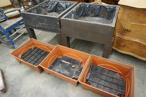 lot 48 image: 2 Large Outdoor Raised Wood Planters  3 Orange Square Plastic Planters