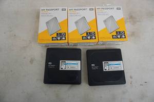 lot 74 image: 3 My Passport Ultra Hard Drives  2 My Passport Wireless Pro