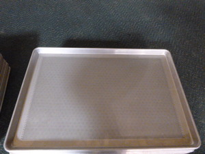 lot 38 image: 15 Perforated Sheet Pans