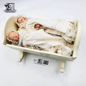 lot 213 image: Porcelain Baby Twin In Rocker