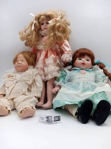lot 007 image: Three Porcelain Dolls, (sleeping baby boy, standing, and baby girl)