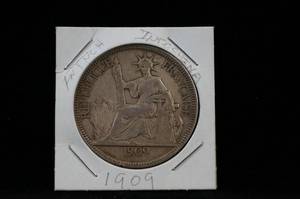lot 8 image: 1909 French Indo-China Piastre Coin
