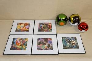 lot 130 image: Pokemon Framed Pictures and Tin Balls
