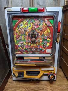 lot 12 image: Vintage Sankyo Pachinko Machine - Umbrella Man