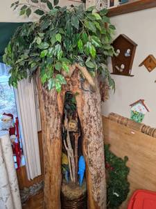 lot 10 image: Split section of tree trunk with fake tree inside and jungle ephemera
