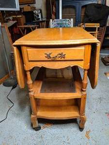 lot 813 image: Drop Leaf Table on Wheels with Drawer and Slide Out Glass Shelf