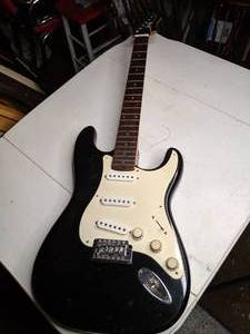 lot 165 image: Squier Guitar by Fender - no strings