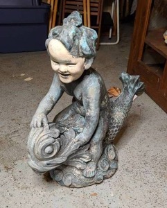 lot 819 image: Boy Riding Fish Garden Statue