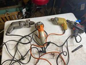 lot 989 image: Three Drills and an Electric Grinder