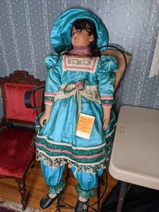 lot 320 image: Large Doll and Iron Chair
