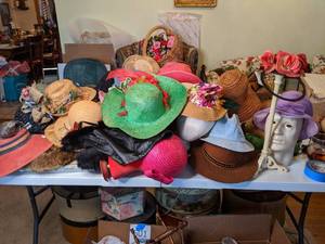 lot 619 image: Table Full of Hats (plus stands and & umbrellas)