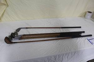 lot 1 image: Lot of (6) Vintage Wood Shafted Golf Clubs - Lo Skore Chromium Left Handed Mid Iron, Macgregor Edgemont E5 Mid Iron, Burma 3 Iron, Wright&Ditson St. Andrews Wood Driver, Carl Lindgren Special Mashie, Wright&Ditson St. Andrews Accurate Iron