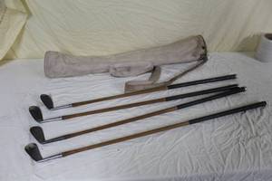 lot 4 image: Lot of (4) Vintage Tommy Armour Open Champion Wood Shafted Golf Irons with Vintage Period Golf Club Bag - 2, 5, 7, 8