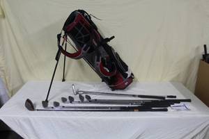 lot 30 image: Lot of (8) Adams Golf Clubs - 5 Iron, 6 Iron, 7 Iron, 8 Iron, 9 Iron, Putter, Sand Wedge, Driver, Sun Mountain Golf Club Bag, Ball Grabber