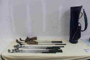 lot 35 image: Lot of (11) Wilson Golf Clubs - X31 3 Iron, 4 Iron, 5 Iron, 6 Iron, 7 Iron, 8 Iron, 9 Iron, SW, Staff II 4300 1 Wood, 3 Wood, 5 Wood, Golf Club Bag, Golf Club Wood Leather Covers