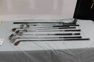 lot 99 image: Lot of (9) Left-Handed Golf Clubs - Bradsbury Lo Skor 2B Mid Iron, Burner 7 Iron, Gene Sarazen Wilson 7 Iron, Adams Golf 8 Iron, Gene Sarazen 9 Iron, Gene Sarazen Wilson 5 Iron, Burner 6 Iron, Odyssey DF 990 Putter, Cleveland 9.5-degree Driver