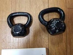 lot 112 image: Lot of (2) Cast Iron Kettlebells 10lb.15lb.