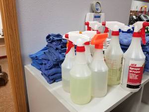 lot 124 image: Lot of (7) Plastic Cleaning Spray Bottles, Several Piles of Hand Towels