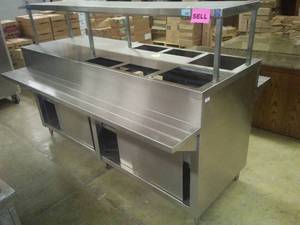 lot 17 image: Serving buffet - double sided with underneath storage. Stainless Steel.