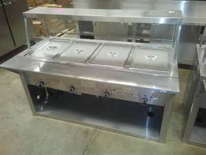 lot 18 image: 4 place Food warmer. Stainless Steel - Gas by Duke.