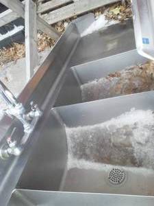 lot 26 image: Triple sink stainless with edge countertop. 76 long.