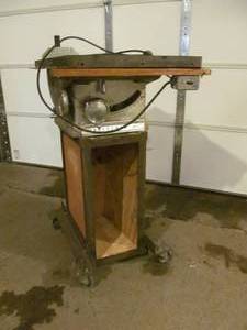 Vintage table saw on heavy duty cart
