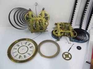 lot 64 image: 2 Antique Clock Movements Assorted Parts & Books on Clock Repair
