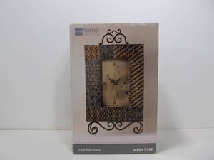 lot 17 image: New in Box Metal Scroll Clock