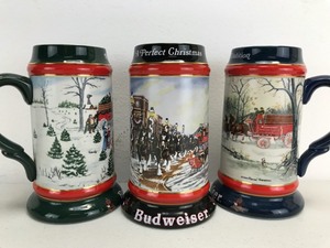 lot 5 image: Budweiser Christmas Collector Series Beer Steins 1990-1992 (Lot of 3)